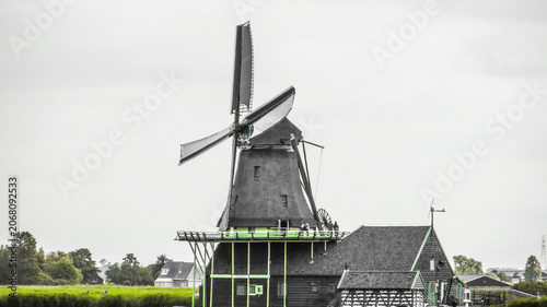 De Kat Windmill. Traditional Dutch old wooden windmill in Zaanse Schans - museum village in Zaandam. The Netherlands.