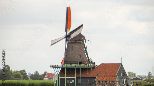 De Kat Windmill. Traditional Dutch old wooden windmill in Zaanse Schans - museum village in Zaandam. The Netherlands.