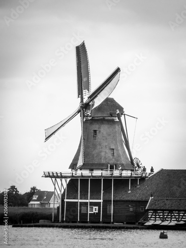 De Kat Windmill. Traditional Dutch old wooden windmill in Zaanse Schans - museum village in Zaandam. The Netherlands.
