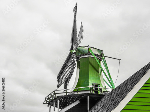 The windmill “De Huisman” (The Huisman). Traditional Dutch old wooden windmill in Zaanse Schans - museum village in Zaandam. The Netherlands.