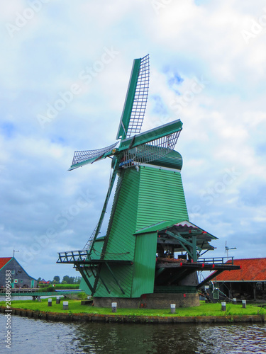 De Gekroonde Poelenburg Windmill (The Crowned Poelenburg). Traditional Dutch old wooden windmill in Zaanse Schans - museum village in Zaandam. The Netherlands.