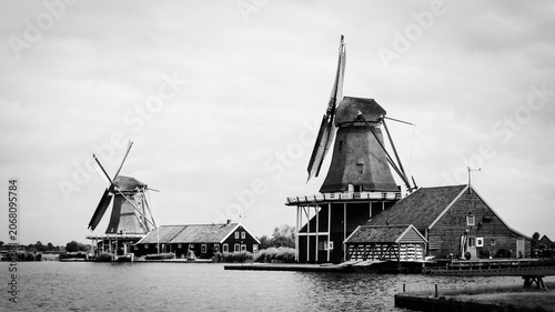 Traditional Dutch old wooden windmills in Zaanse Schans - museum village in Zaandam. The Netherlands.