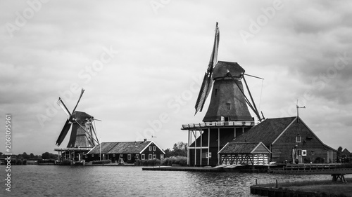 Traditional Dutch old wooden windmills in Zaanse Schans - museum village in Zaandam. The Netherlands.