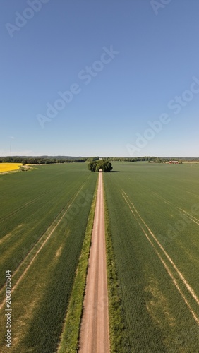 Canvas Print Aerial view of the straight road leading towards Bjärka-Säby New Castle (Nya Slottet) in Sweden