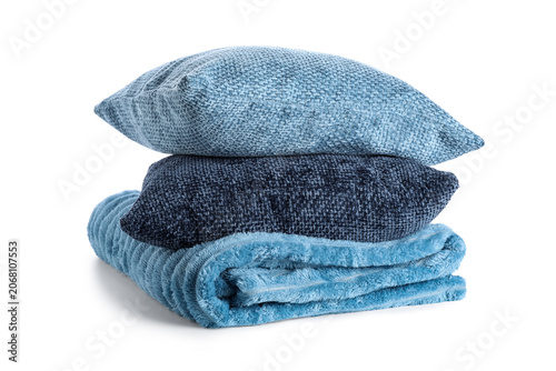 Stacked blue pillows and fo...
