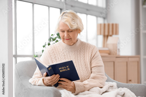 Christian senior woman read...