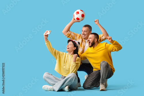 Soccer fans with ball takin...