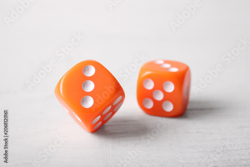 Orange game dices on white ...