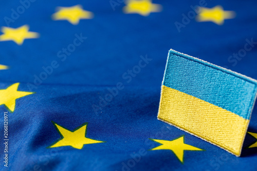 Fotografie Ukraine flag patch on European Union flag background with copy space