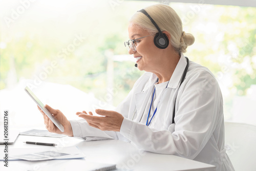 Female doctor with headset ...