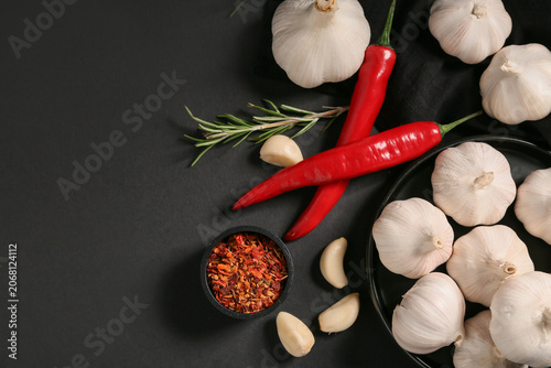 Plate with fresh garlics an...