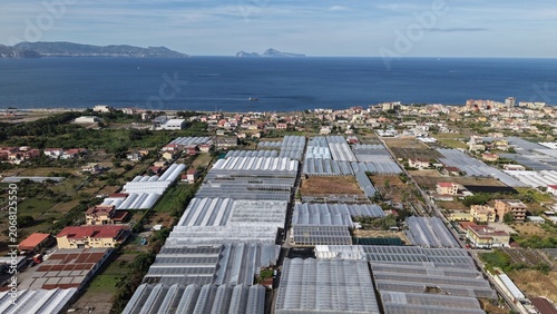 Bild auf Leinwand Aerial view of greenhouse farming grid along Torre Del Greco coastline with Medi