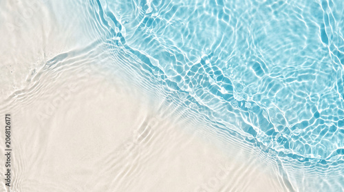 Clear Rippled Blue Water Surface on White Sand, Abstract Clean Wave Background and Texture
