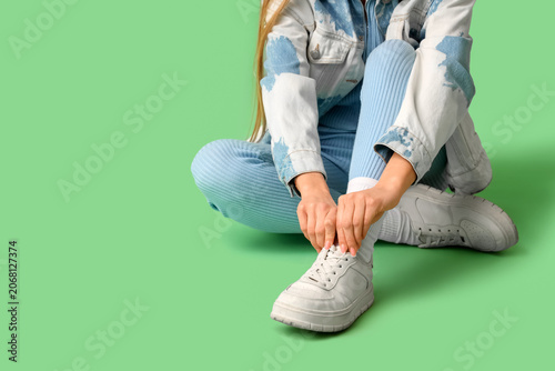 Stylish young woman in whit...