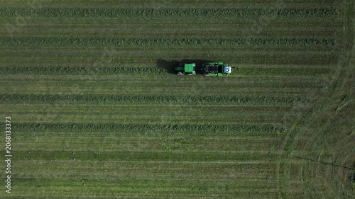 Tractor collects hay 