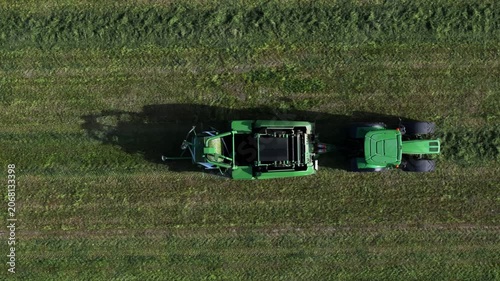 Tractor collects hay on the farm