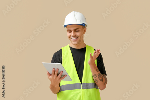 Young male engineer with ta...