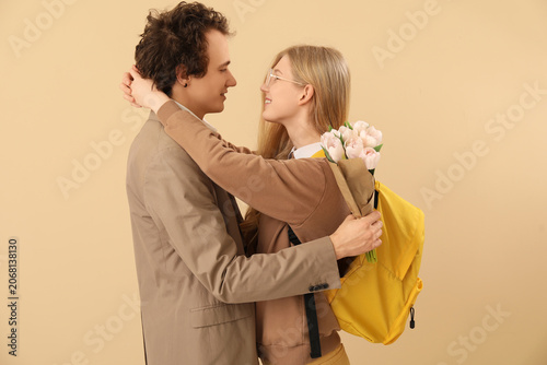 Teenage girl hugging her bo...