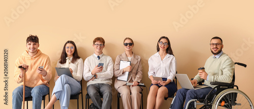 Fotografía Job applicants with blind woman and man in wheelchair waiting for interview near