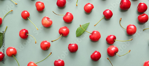 Many sweet cherries on gree...