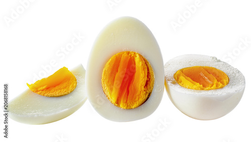 Bilde på lerret Isolated perfectly cooked hard-boiled eggs sliced, showing firm orange yolks and white albumen