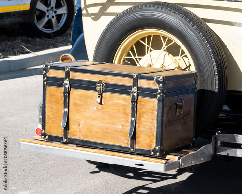 Old luggage trunk on a historic car
