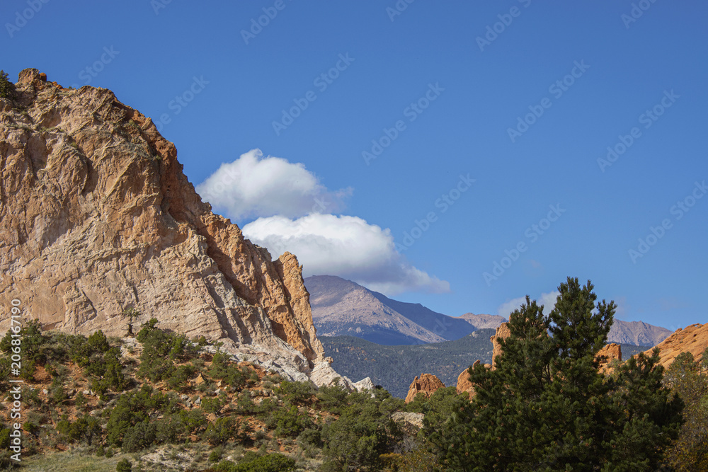 Fototapeta premium Rocky Mountains from the view of the stunning red rocks from the Garden of the Gods in Colorado Springs, Colorado