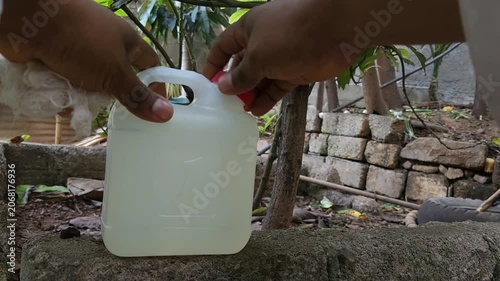 Opening Plastic Jerrycan Lid of Paint Thinner Solvent Closeup