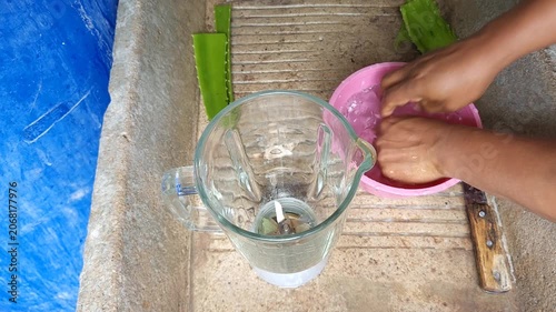 Washing Hands and Raw Aloe Vera Leaves under Running Water