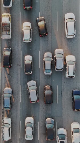 Top Down Aerial View of City Traffic Jam with Multiple Vehicles on Multi-Lane Highway Avenue Street Road