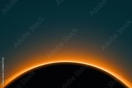 Glowing orange crescent curves across a dark sphere against a gradient sky