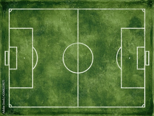 Top-down view of a green soccer field with white markings on a textured surface