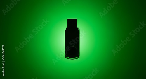Black USB Flash Drive Silhouette with Green Halo Glow on Dark Background