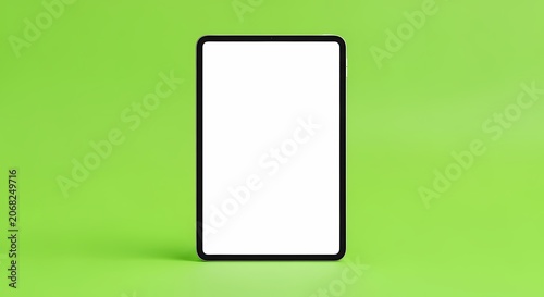Modern tablet device with blank screen on vibrant green background, technology mockup