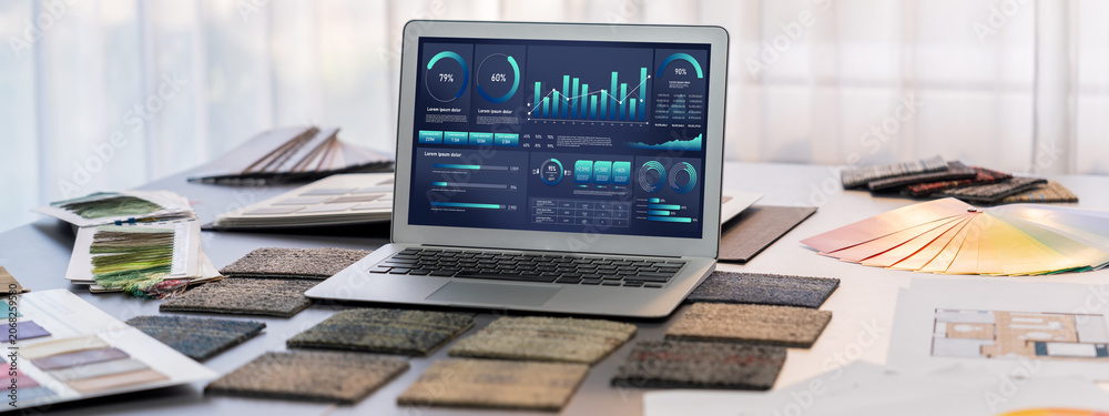 Fototapeta premium Interior designer workspace table and architecture software on laptop screen with mood board materials and colorful swatch color for color selection. Modern interior design office. Insight