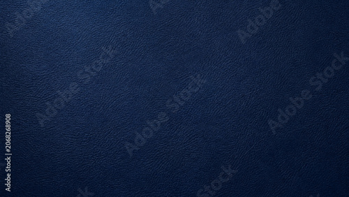 Dark blue leather texture close up with subtle grain and shading