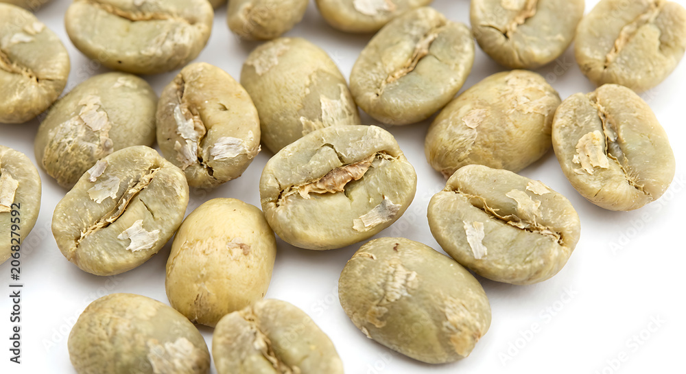 Obraz premium Macro Raw Green Coffee Beans on White Background