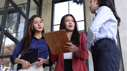 Businesswoman discussing company project report.