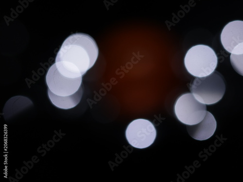 Canvas-taulu Un fondo abstracto de luces de navidad de diferentes colores en la oscuridad