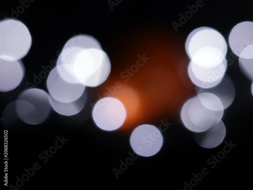 Photos Un fondo abstracto de luces de navidad de diferentes colores en la oscuridad