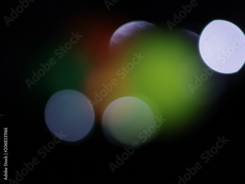 Photos Un fondo abstracto de luces de navidad de diferentes colores en la oscuridad