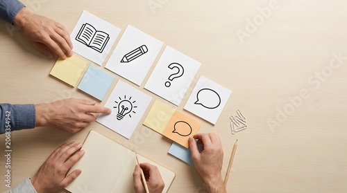 Agile Team Brainstorming and Design Thinking Workshop Concept with Hands Organizing Icon Sticky Notes