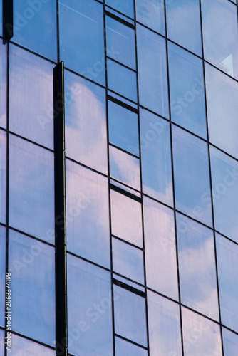 modern office building facade reflecting the sky