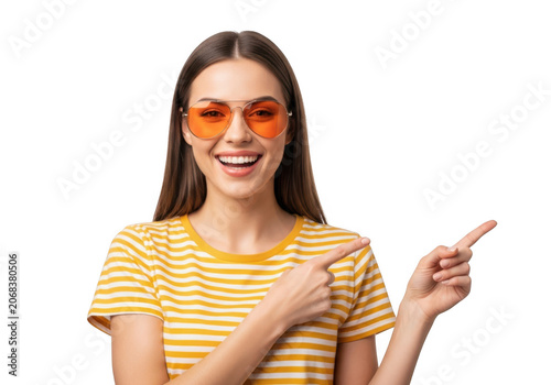 Excited young woman wearing orange sunglasses and a yellow striped shirt, pointing in two directions