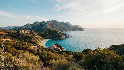 Scenic coastal landscape with turquoise bay and mountains in corsica