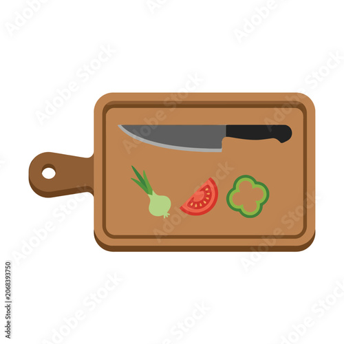 Wooden cutting board with a knife and fresh vegetables