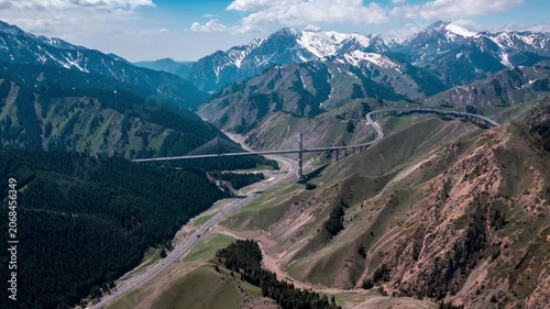 Aerial View of Guozigou Bridge in the Snowy Mountains of Xinjiang, China in Guozigou, Xinjiang, China