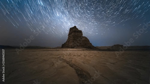 Star Trails Over Desert Rock Formation at Night