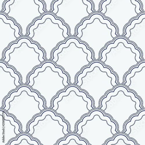 Sophisticated nautical scallop pattern framed by rope-inspired scalloped medallion