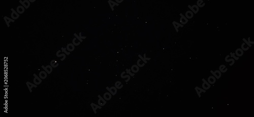 Fotografía Minimalist starry night sky background, deep black space with subtle white stars